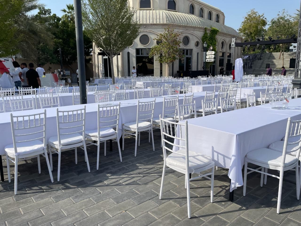 Outdoor banquet tables and chairs set for a large gathering