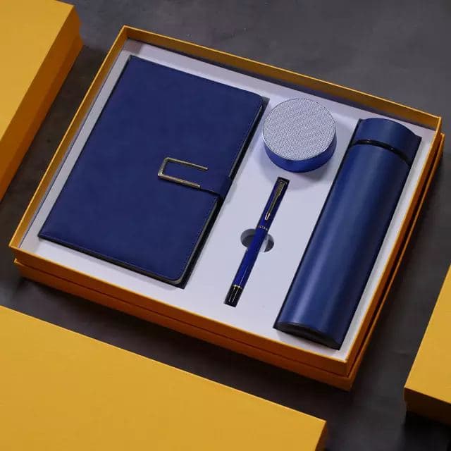 A corporate gift set with notebook, pen and flask in a box