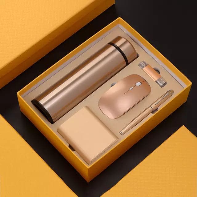 A gift box with flask, mouse and accessories