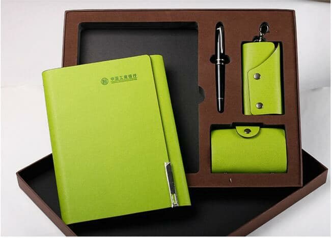 A green notebook gift set with pen and accessories