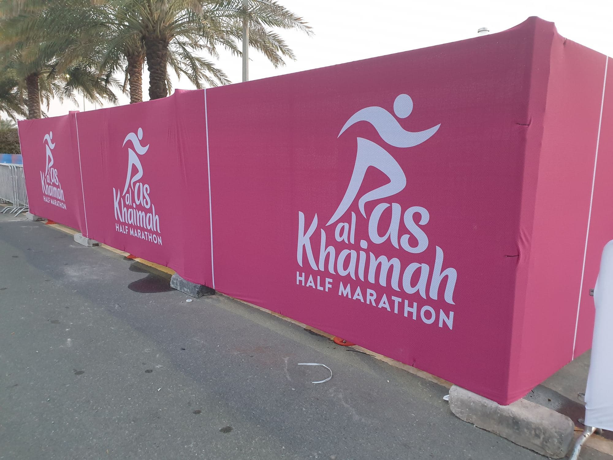 Temporary fencing wrapped in printed race branding