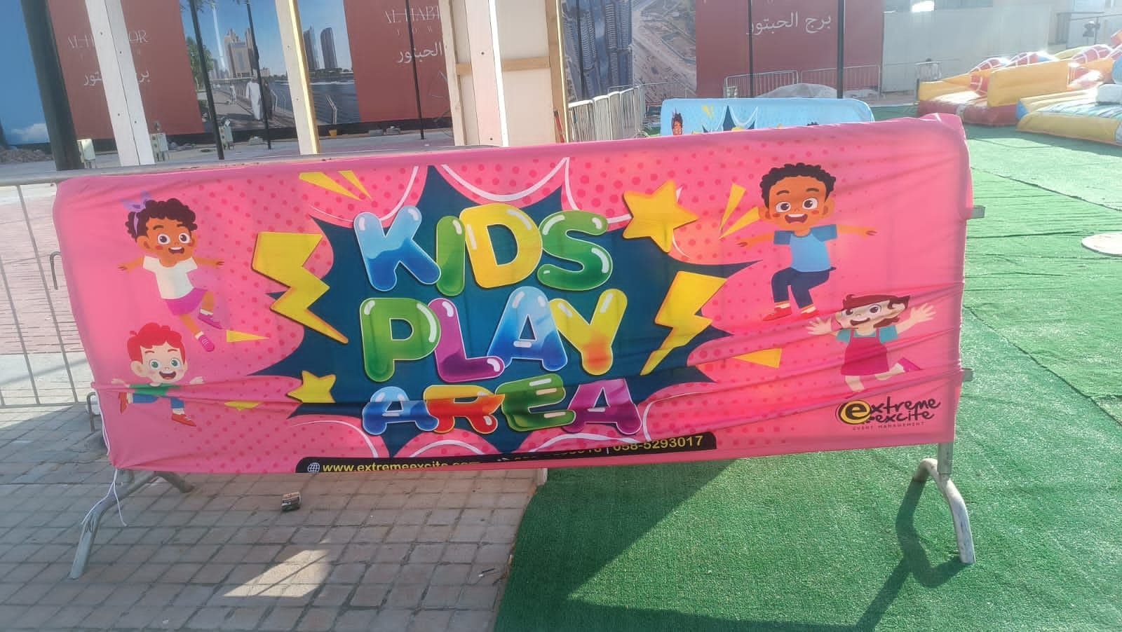 A barrier cover printed with colourful artwork for a kids zone