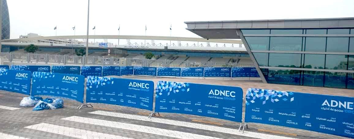 Blue branded barrier covers outside an exhibition venue