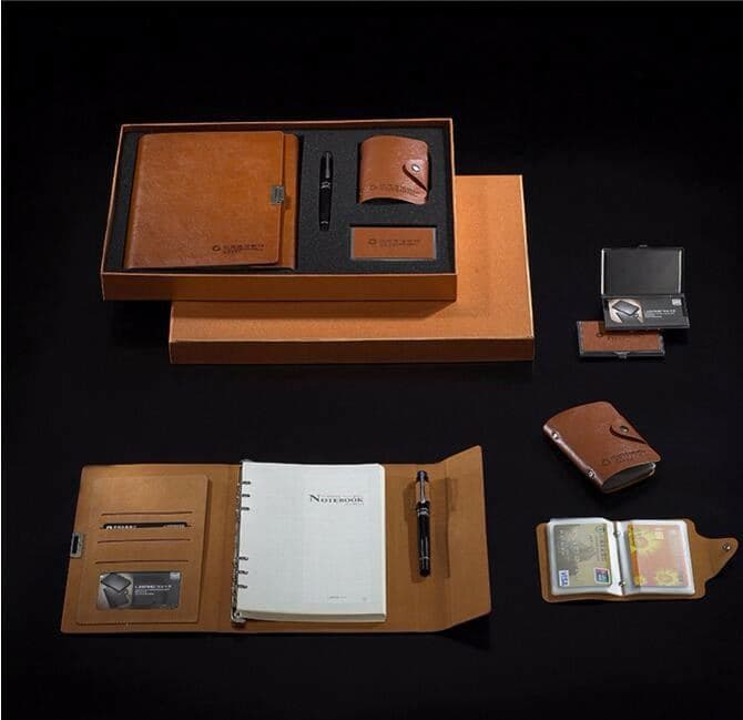 Leather notebooks, wallets and card holders as gift sets